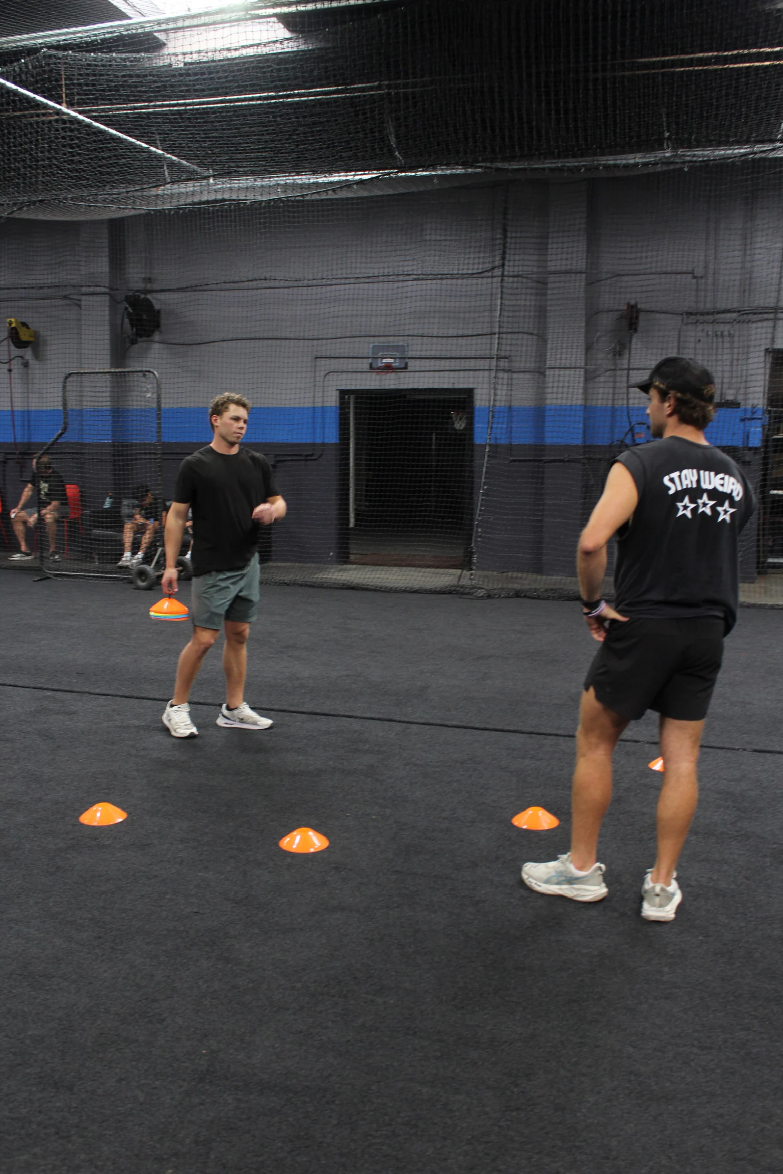 Jarrod Hocking coaching an athlete through a cone drill